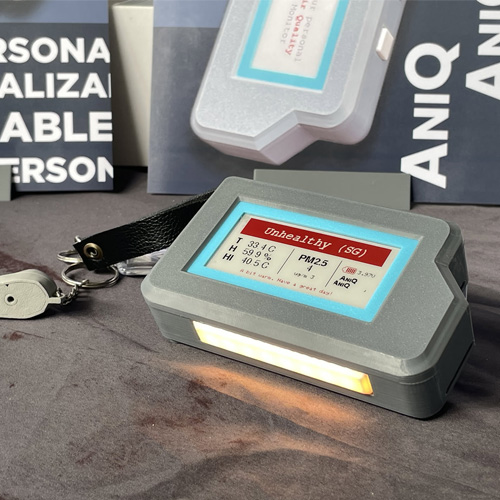 Handheld grey air quality device with an e-ink screen and a lit translucent status bar