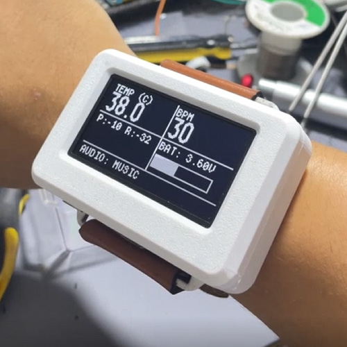 White printed wrist-worn device showing temperature and heart-rate readings on a dark screen
