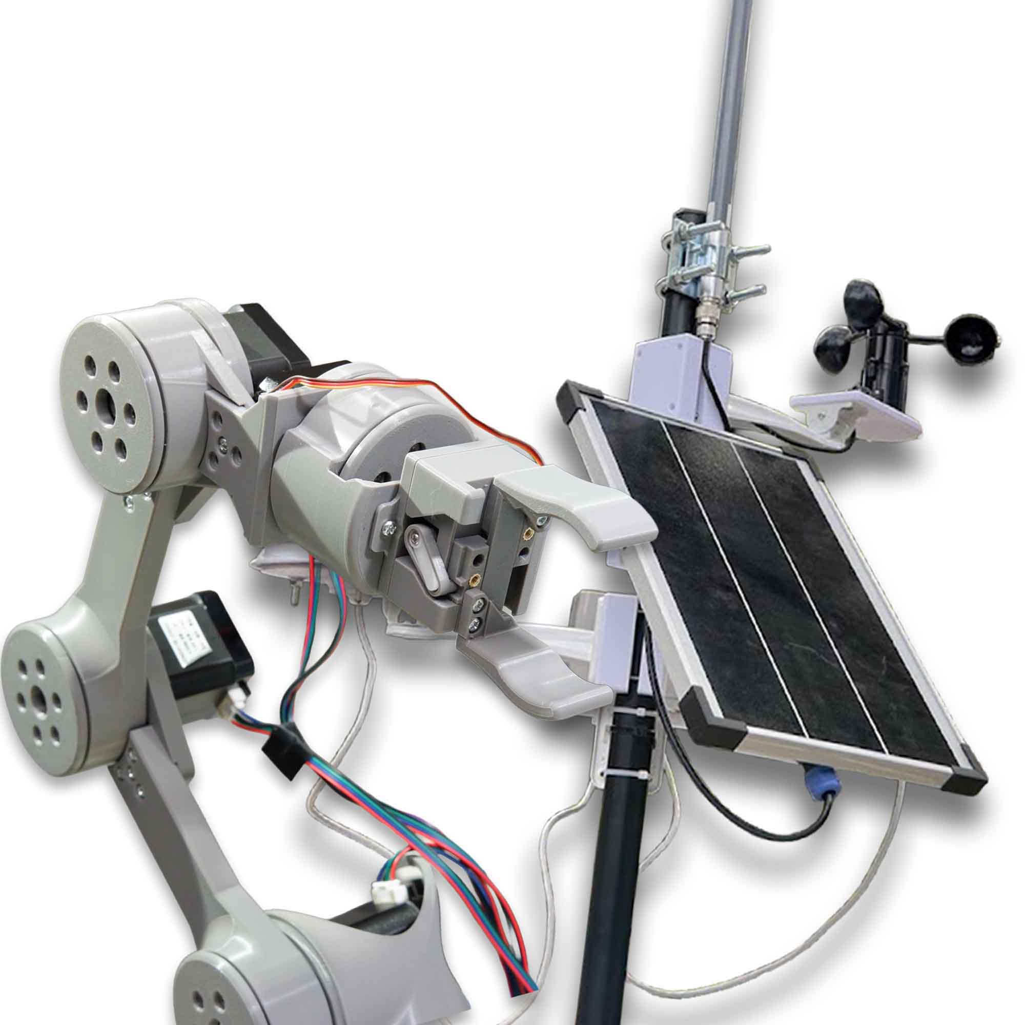 A 3D-printed robot arm built by Elliztronics stands upright on a workbench with its control wiring running to the joints